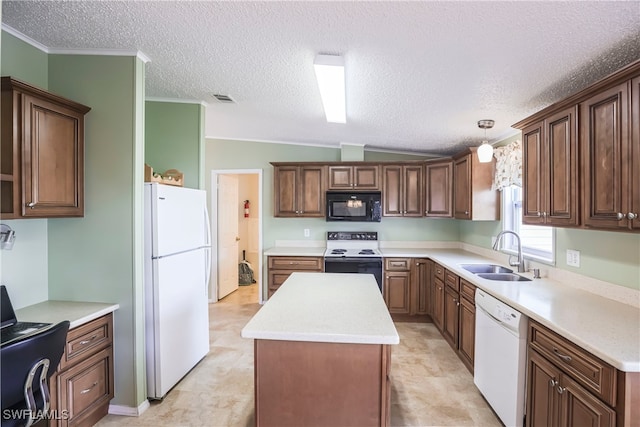 kitchen with decorative light fixtures, lofted ceiling, sink, a center island, and white appliances