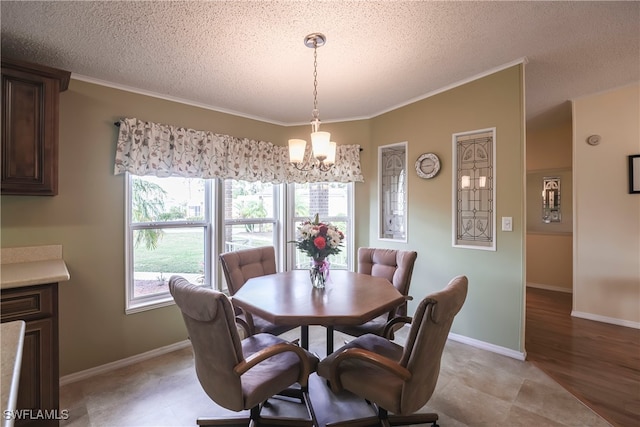 dining space with an inviting chandelier, crown molding, and a textured ceiling