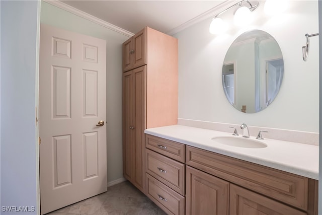 bathroom with vanity, crown molding, and tile patterned floors