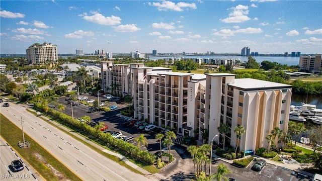 exterior space with a water view and a city view