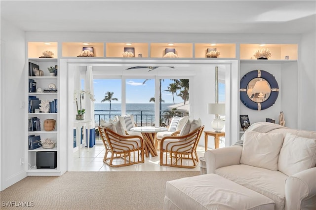 sunroom / solarium with a water view