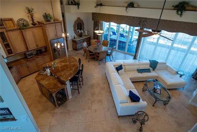 living room featuring ceiling fan and light tile patterned floors