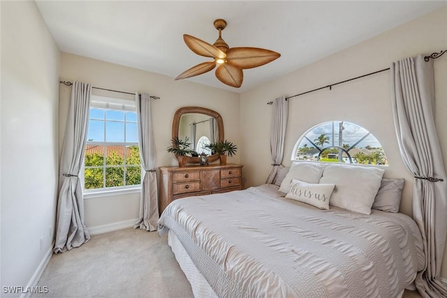 bedroom featuring ceiling fan and light colored carpet