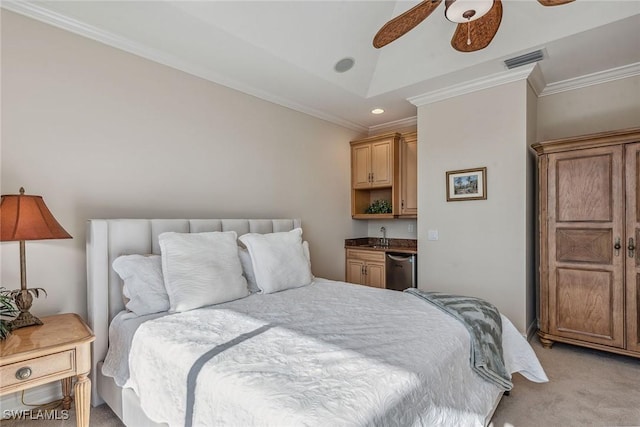 carpeted bedroom featuring sink, vaulted ceiling, crown molding, and ceiling fan