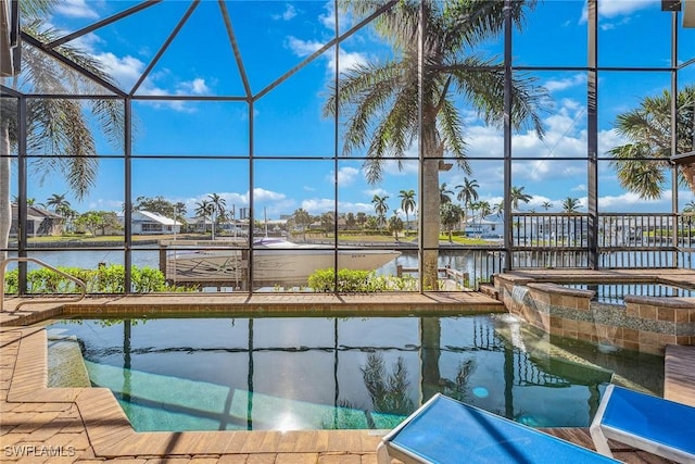 view of pool featuring a lanai and a water view