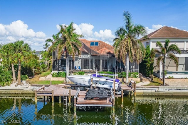 dock area featuring a water view and glass enclosure