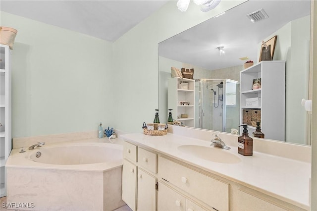 full bath with a garden tub, vanity, a shower stall, and visible vents