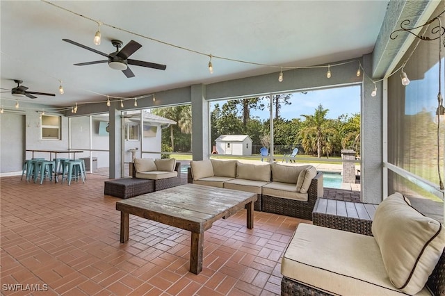 sunroom / solarium with ceiling fan