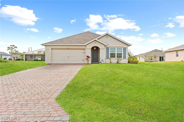 single story home with a front lawn, decorative driveway, an attached garage, and stucco siding