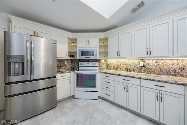 kitchen with white appliances, visible vents, white cabinetry, and open shelves