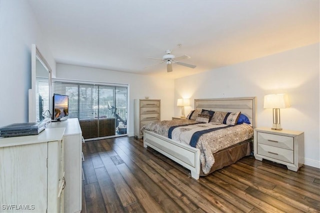 bedroom featuring dark wood-type flooring, ceiling fan, and baseboards