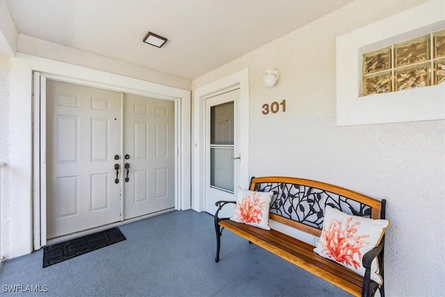 property entrance featuring covered porch