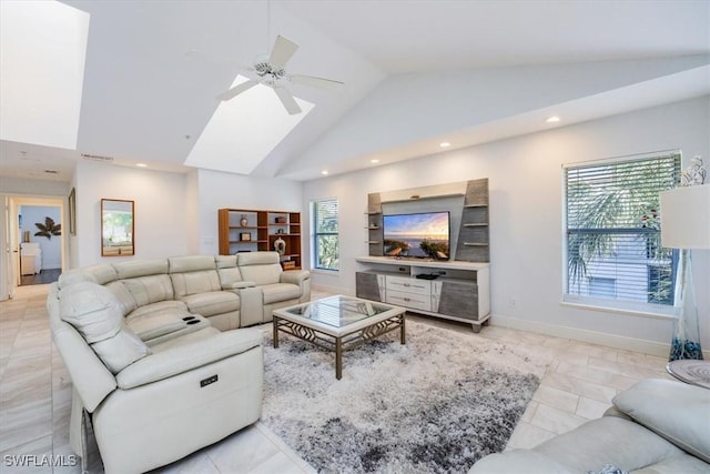 living area featuring a ceiling fan, a wealth of natural light, baseboards, and recessed lighting