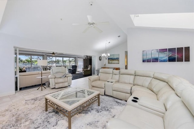 living room featuring high vaulted ceiling, light tile patterned floors, baseboards, and ceiling fan with notable chandelier