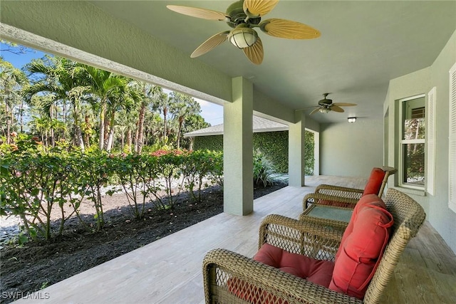 view of patio featuring ceiling fan