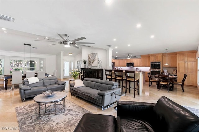 living room featuring visible vents, ornamental molding, recessed lighting, ceiling fan, and vaulted ceiling