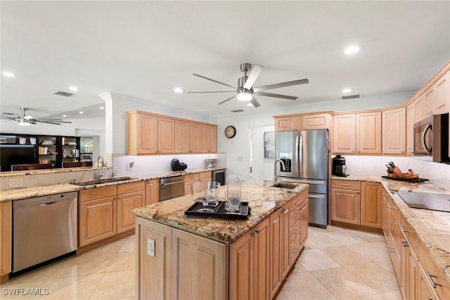 kitchen featuring visible vents, light brown cabinets, a sink, appliances with stainless steel finishes, and ceiling fan