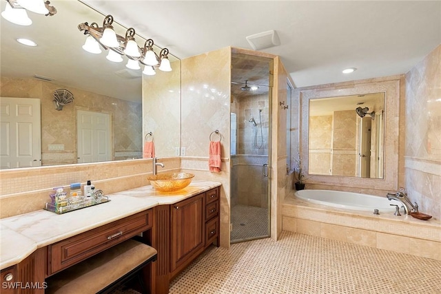 full bath featuring vanity, a garden tub, a shower stall, tile walls, and tile patterned floors