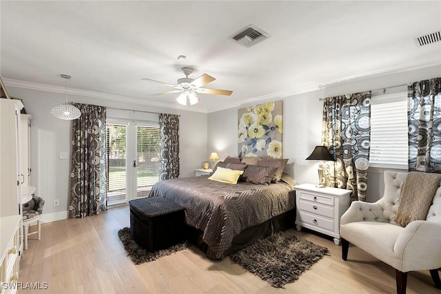 bedroom with visible vents, ornamental molding, light wood-type flooring, and access to outside