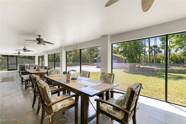 sunroom with ceiling fan