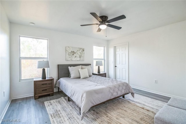 bedroom with hardwood / wood-style floors and ceiling fan