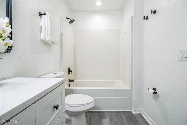 full bathroom with shower / bathtub combination, vanity, toilet, and hardwood / wood-style floors