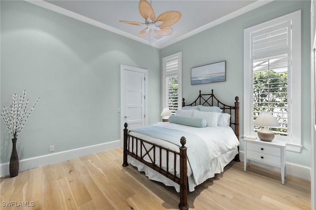 532 Pine Grove Ln, Naples, FL 34103 - bedroom with light wood-type flooring, baseboards, crown molding, and multiple windows