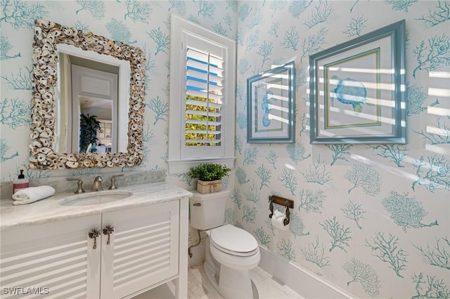 532 Pine Grove Ln, Naples, FL 34103 - bathroom featuring vanity, toilet, and wallpapered walls