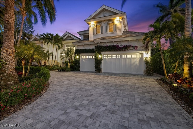 532 Pine Grove Ln, Naples, FL 34103 - mediterranean / spanish-style house featuring an attached garage and decorative driveway