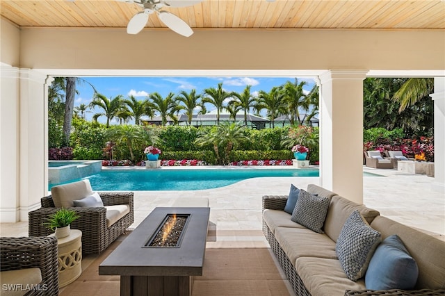 532 Pine Grove Ln, Naples, FL 34103 - view of pool with an outdoor living space with a fire pit, a patio area, a pool with connected hot tub, and ceiling fan