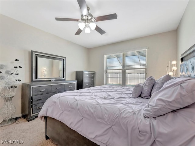 bedroom featuring light colored carpet and ceiling fan