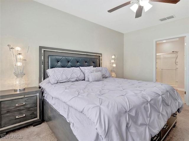 carpeted bedroom featuring ensuite bathroom and ceiling fan