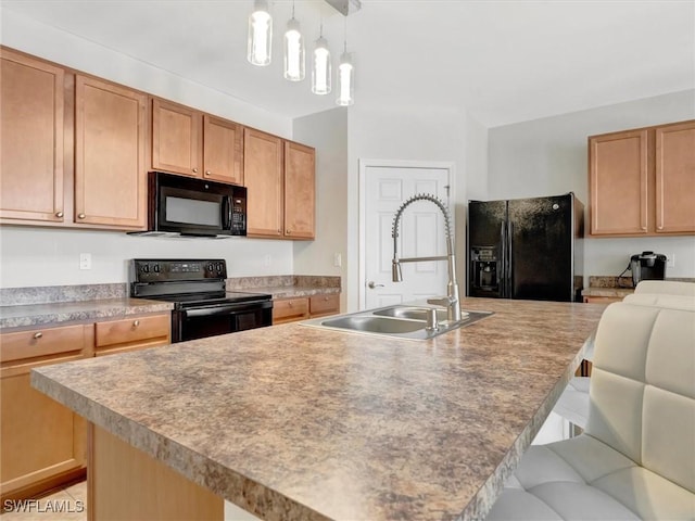 kitchen featuring sink, a kitchen bar, black appliances, and a center island with sink