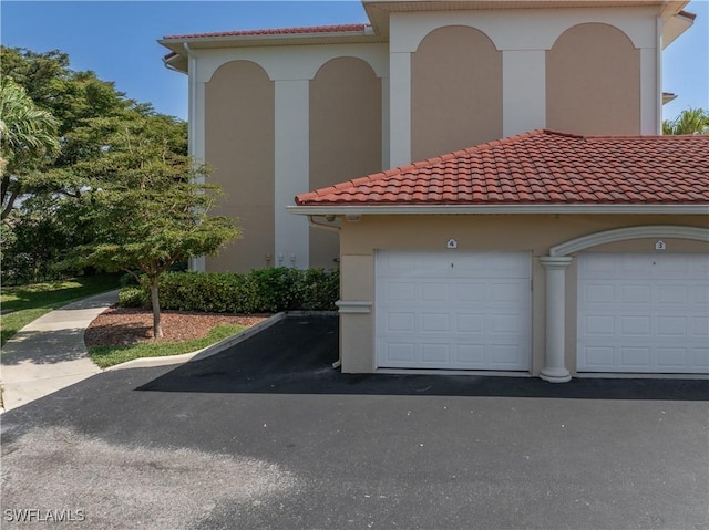 mediterranean / spanish-style house featuring a garage