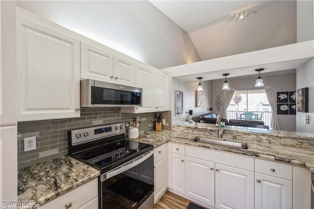 kitchen featuring white cabinets, stainless steel appliances, and sink