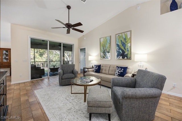 living room featuring ceiling fan, wood-type flooring, and high vaulted ceiling