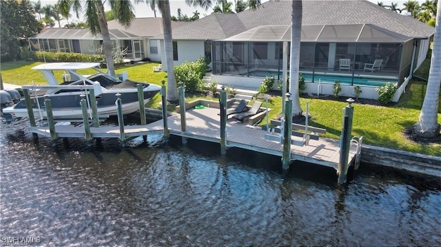 view of dock featuring glass enclosure, boat lift, a water view, a yard, and an outdoor pool