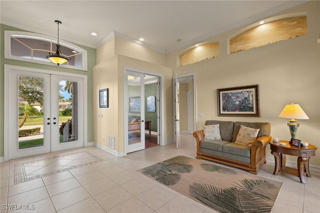 interior space with crown molding and french doors