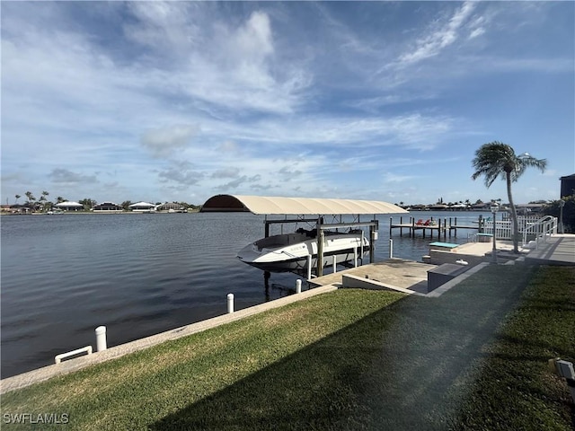 dock area with a water view and boat lift