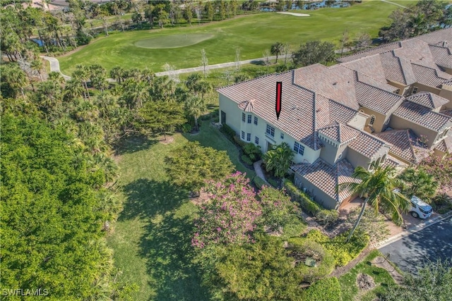 birds eye view of property with view of golf course