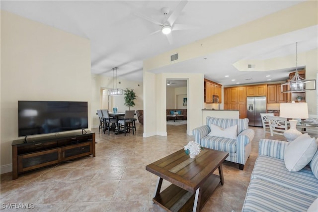 living room with light tile patterned floors, baseboards, visible vents, a ceiling fan, and recessed lighting