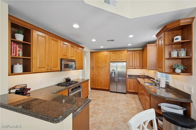 kitchen featuring open shelves, appliances with stainless steel finishes, a peninsula, and visible vents