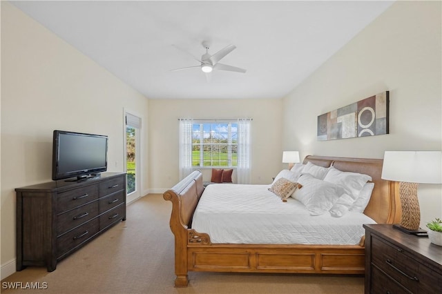 bedroom with light carpet, ceiling fan, and baseboards