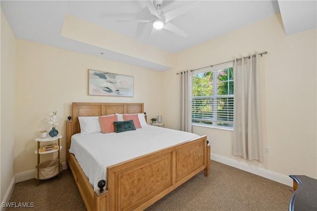 carpeted bedroom with a ceiling fan and baseboards