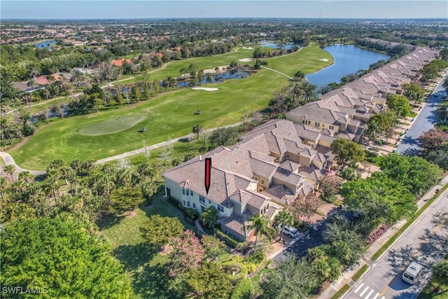 aerial view with view of golf course and a water view