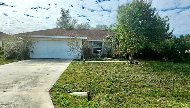 ranch-style home with a front yard and a garage