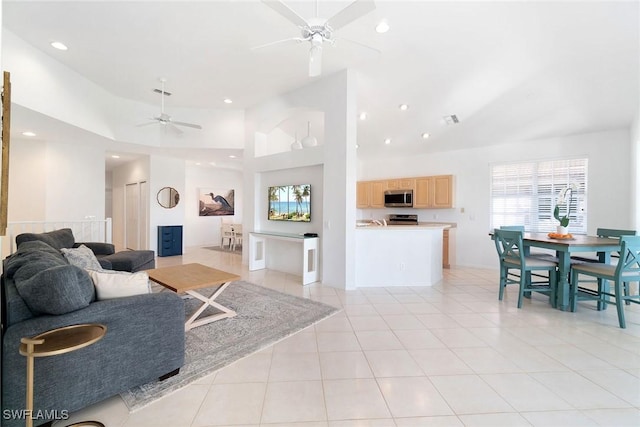 living room with ceiling fan, recessed lighting, plenty of natural light, and light tile patterned floors