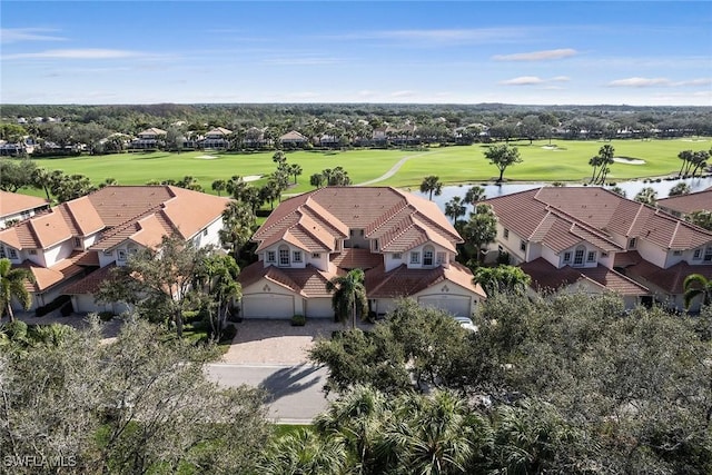 aerial view with a water view, golf course view, and a residential view