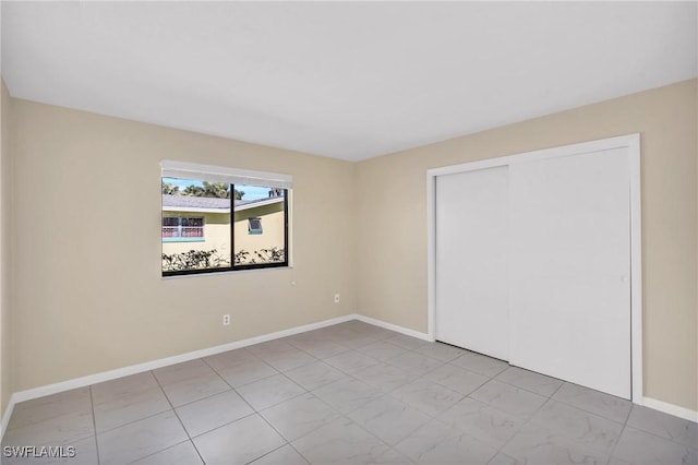 unfurnished bedroom with a closet