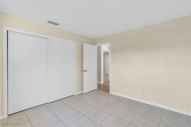 unfurnished bedroom featuring a closet